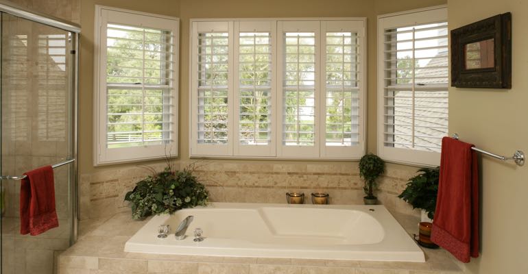 Plantation shutters in Charlotte bathroom.